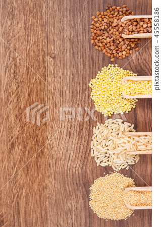 Various groats, rice and quinoa seeds with scoop 45558186