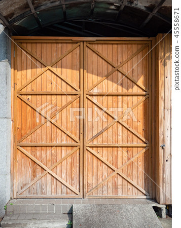Old wooden doors. Warehouse entrance. Old wooden doors. Warehouse entrance. 45558671