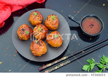 Spicy chicken balls in sweet chilly glazur Spicy chicken balls in sweet chilly glazur 45560053