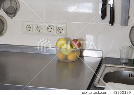 A lot of apples in a plstic bowl. A lot of apples in a plstic bowl. 45560339