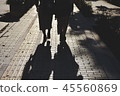 Silhouette of a women walking on the street 45560869