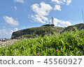 White lighthouse with blue sky 45560927