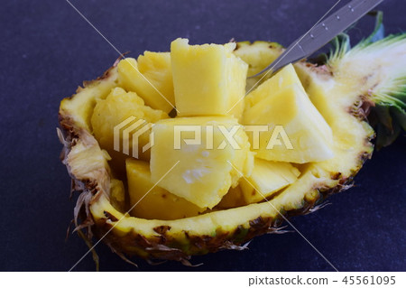 Pineapple cubes in its own pineapple bowl 45561095