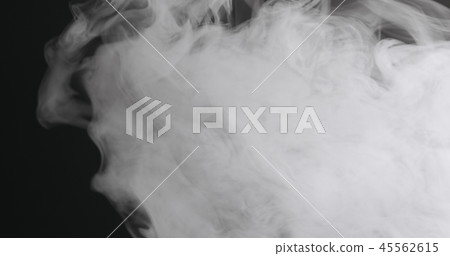 Slow motion closeup vapor floating in air on black background Slow motion closeup vapor floating in air on black background 45562615