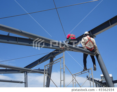 Workers fabricating mild steel roof trusses. Workers fabricating mild steel roof trusses. 45562934