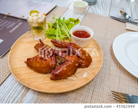 Grilled chicken wings with tomato sauce on the tab Grilled chicken wings with tomato sauce on the tab 45562949