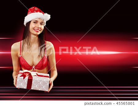 Santa girl delivering present Santa girl delivering present 45565801