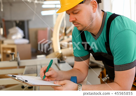 Portrait of young attractive man in work Portrait of young attractive man in work 45565855