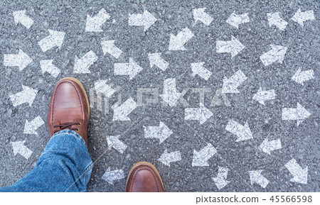 Top view of man wearing shoes choosing a way mark 45566598