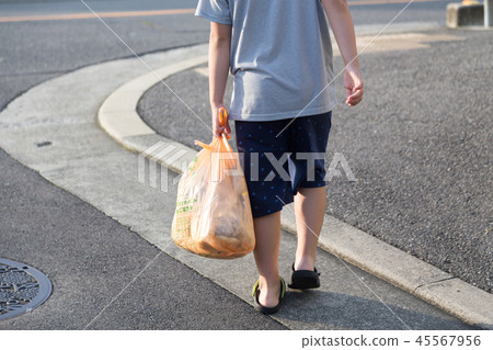 Child throwing away trash Child throwing away trash 45567956