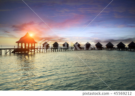 Silhouette hut over the transparent quiet sea wate 45569212