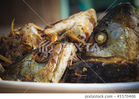 Fried fish heads for a simple meal of rural people Fried fish heads for a simple meal of rural people 45570406