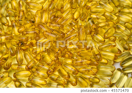 Background of yellow fish oil in pills 45571470