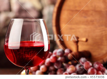 Red wine.Closeup glass of red wine , grapes 45573036