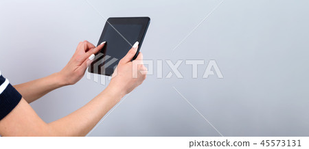 Young woman with a tablet computer 45573131