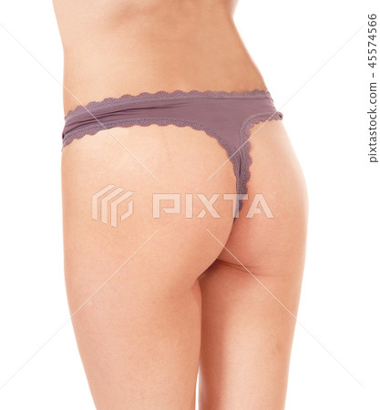 The bottom of a young woman wearing a thong 45574566