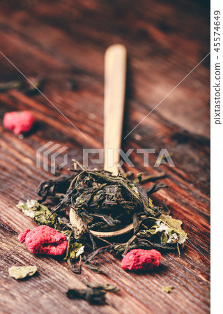 Wooden spoon of raspberry herbal tea 45574649