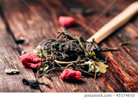 Wooden spoon of raspberry herbal tea 45574650