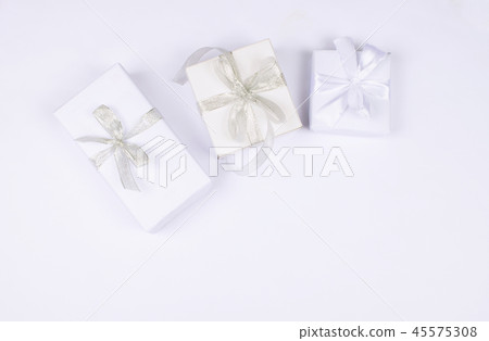 Three gift boxes on white background. 45575308