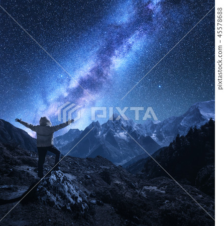 Man with raised up arms on the stone and Milky Way Man with raised up arms on the stone and Milky Way 45578688