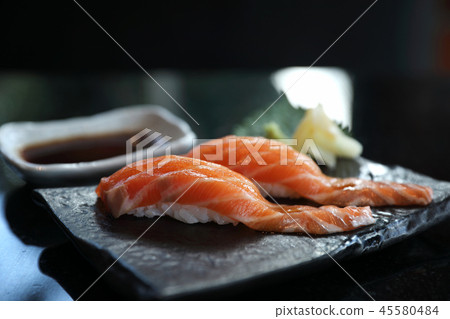 Salmon sushi on black plate japanese food 45580484