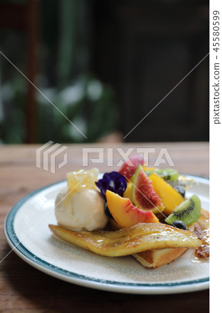 Dessert baked Waffle with fruits kiwo grape berry and vanilla ice cream vintage style 45580599