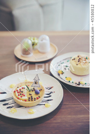 Lemon tart pie topping with chocolate ball sweet dessert on wood background Lemon tart pie topping with chocolate ball sweet dessert on wood background 45580812