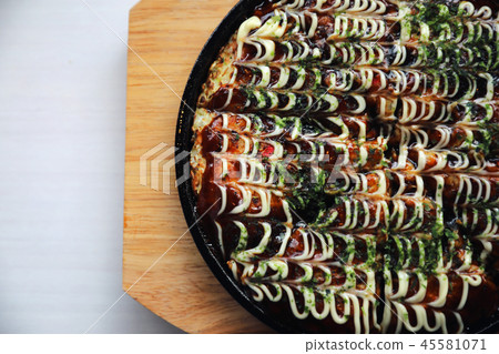 Japanese food okonomiyaki , Japanese pizza on wood plate Japanese food okonomiyaki , Japanese pizza on wood plate 45581071
