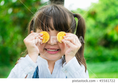 Little girl kid holding bitcoin digital money. 45581722