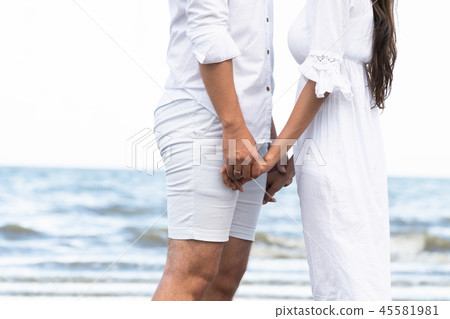 Couple going honeymoon on tropical beach in summer Couple going honeymoon on tropical beach in summer 45581981