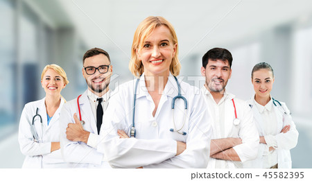 Doctor working in hospital with other doctors. Doctor working in hospital with other doctors. 45582395