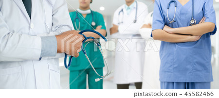 Doctor working in hospital with other doctors. Doctor working in hospital with other doctors. 45582466