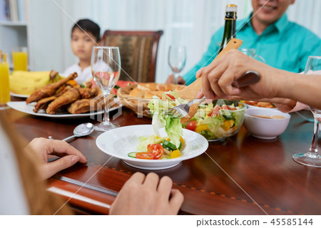 Serving healthy salad Serving healthy salad 45585144
