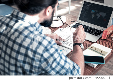 Bearded businessman feeling concentrated on studying Chinese Bearded businessman feeling concentrated on studying Chinese 45588001