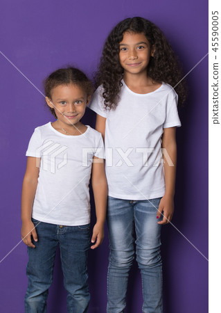 Cute little african american girls in white t-shirts. Mock-up. 45590005