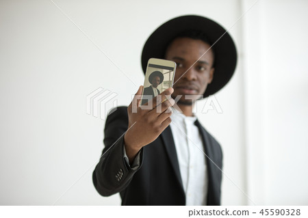 African American man in a hat makes a selfie. African American man in a hat makes a selfie. 45590328