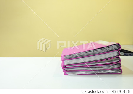Stack of account file documents on white desk Stack of account file documents on white desk 45591466