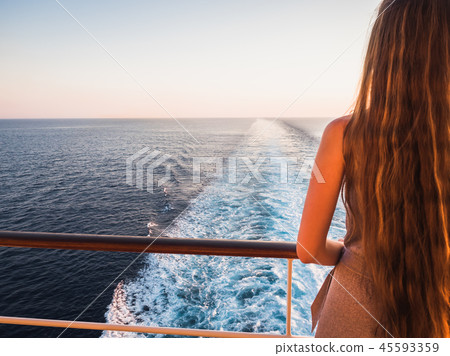 Stylish, beautiful woman on the empty deck 45593359