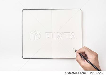 man's hand hold black pencil above notebook 45596552