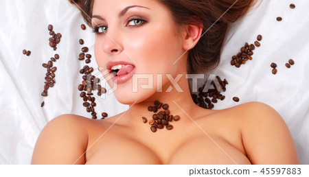 woman with coffee beans woman with coffee beans 45597883