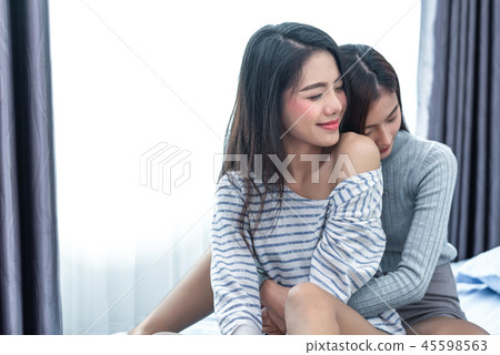 Two Asian Lesbian women hug and embracing Two Asian Lesbian women hug and embracing 45598563