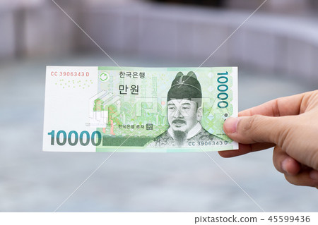 Man hold south korea banknote 10000 won 45599436