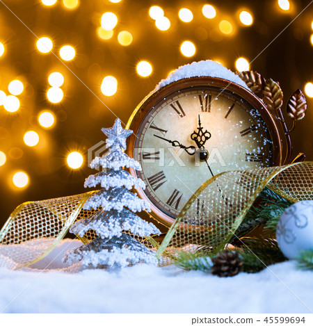 New Year's clock with decoration on snow New Year's clock with decoration on snow 45599694
