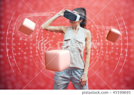 Visual reality concept. Young man using Visual reality or VR headset and interacting with object. Visual reality concept. Young man using Visual reality or VR headset and interacting with object. 45599695