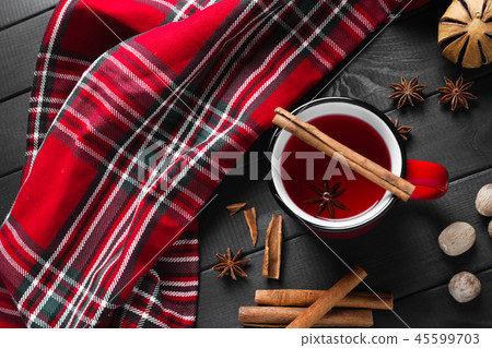 Glass of mulled wine with cinnamon and anise, top view Glass of mulled wine with cinnamon and anise, top view 45599703