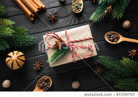 Vintage gift box with christmas decoration on dark wooden background. Vintage gift box with christmas decoration on dark wooden background. 45599705