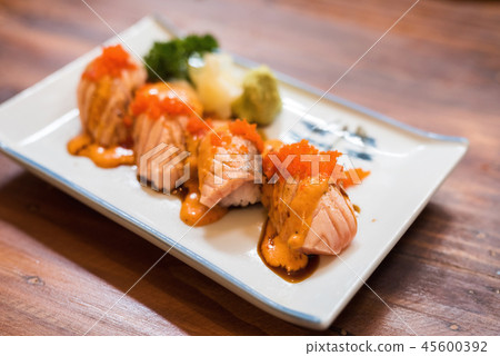 Salmon Sushi roll with fire burn Salmon Sushi roll with fire burn 45600392