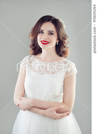 Smiling bride woman in white wedding dress Smiling bride woman in white wedding dress 45604264