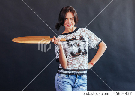 Beautiful young woman with a wooden board Beautiful young woman with a wooden board 45604437