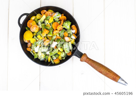 Frying pan with frozen vegetables Frying pan with frozen vegetables 45605196